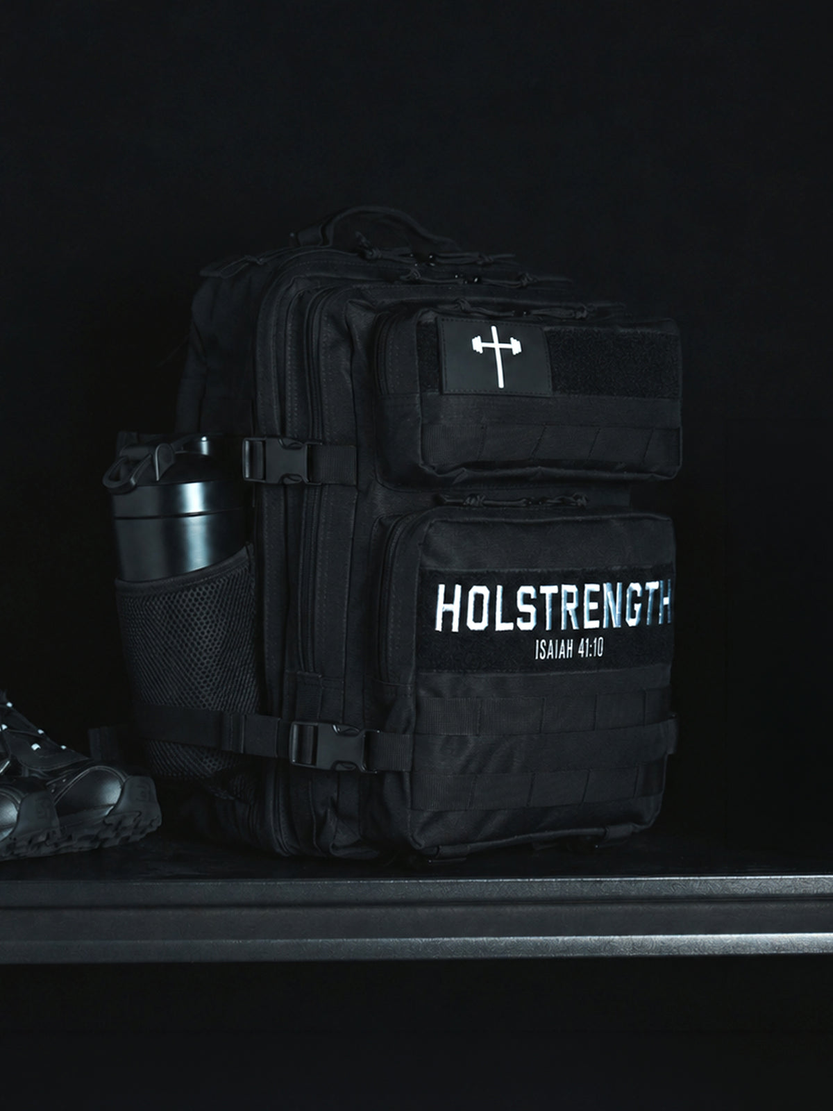 25L Tactical Backpack in black with multiple compartments side bottle pocket cross patch and durable slim design for organized everyday carry