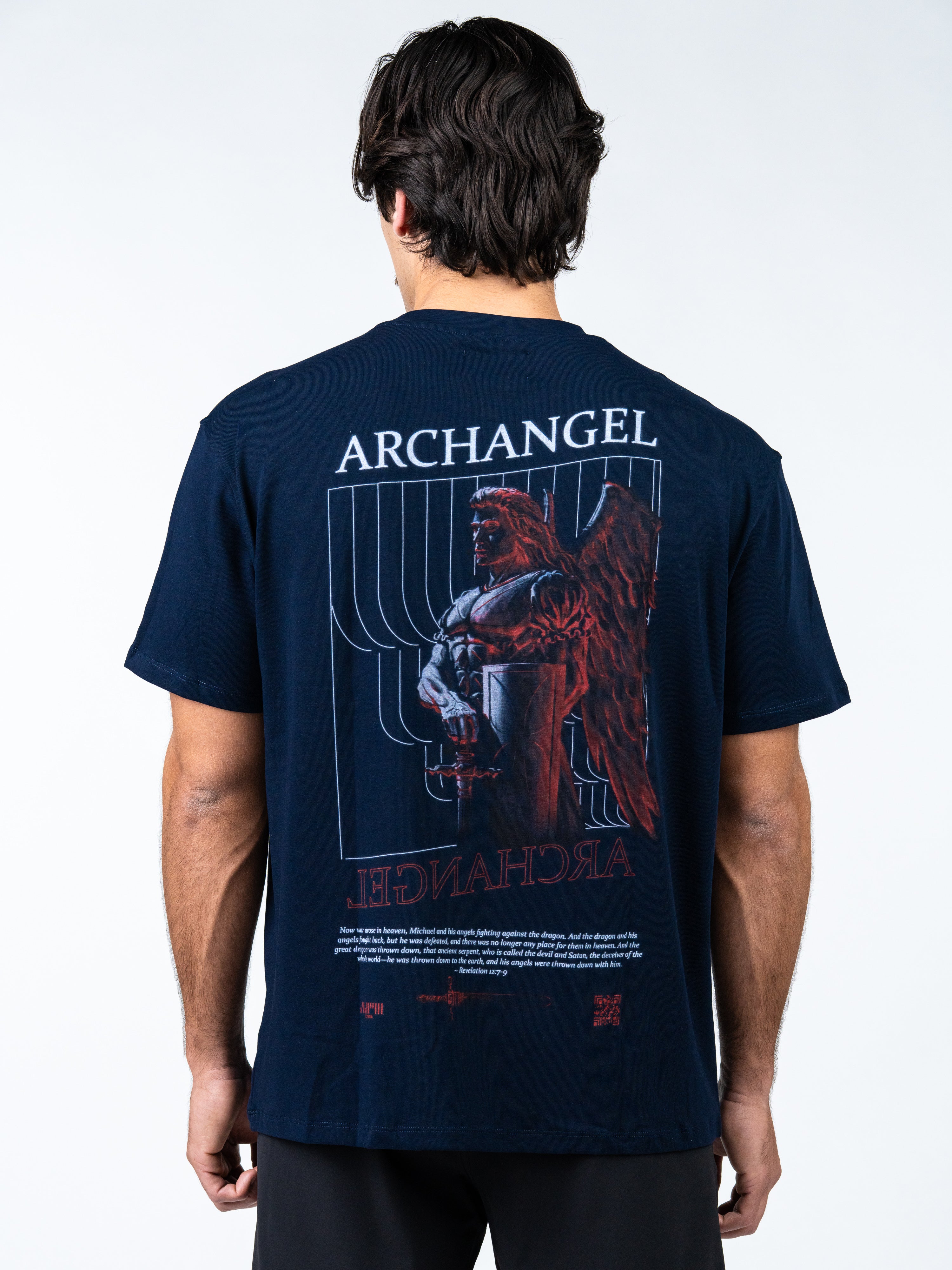 Person wearing a navy blue t-shirt with 'Archangel' graphic design on the back.