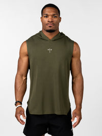 Man wearing an olive green Essential Sleeveless Hoodie featuring a small Christian cross with a barbell design on the chest, paired with black athletic shorts.