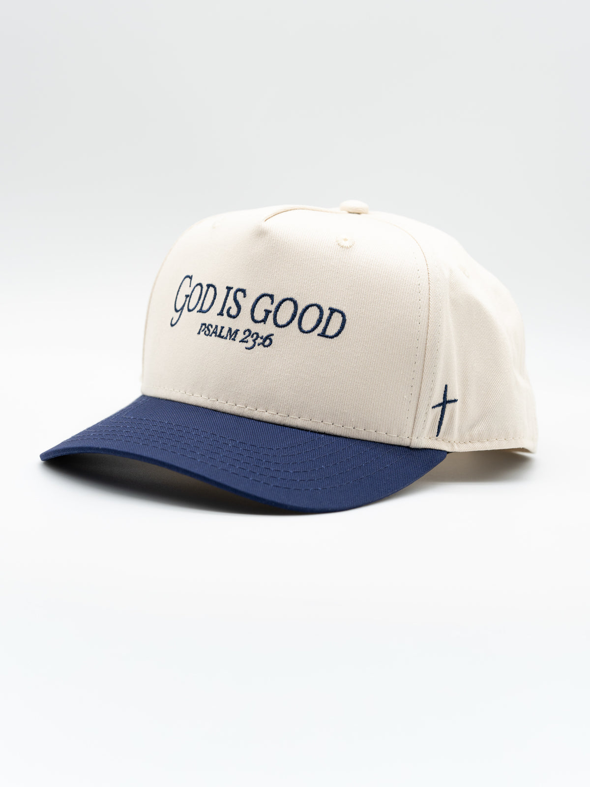 Premium Embroidered Hat with cream five panel crown navy brim God Is Good Psalm 23 6 embroidery and cross detail for faith based apparel
